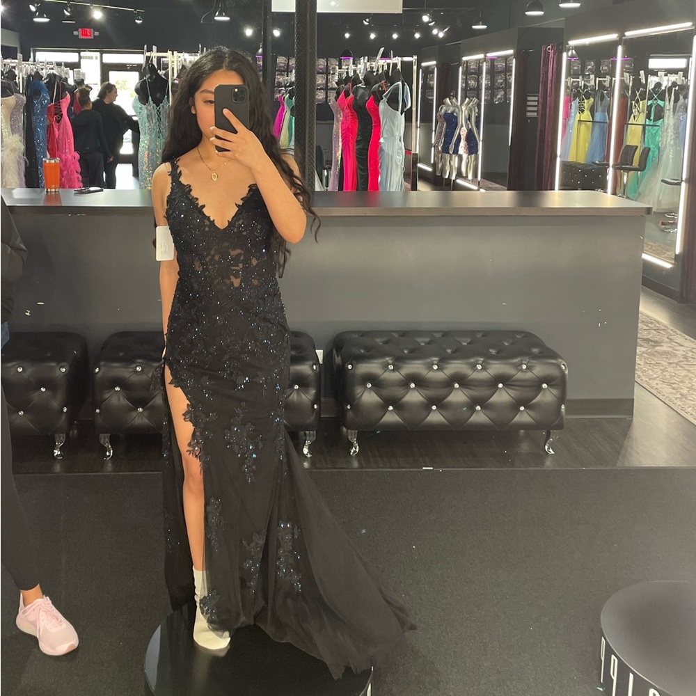 Black prom dress with small royal blue gem detailing. Great condition!